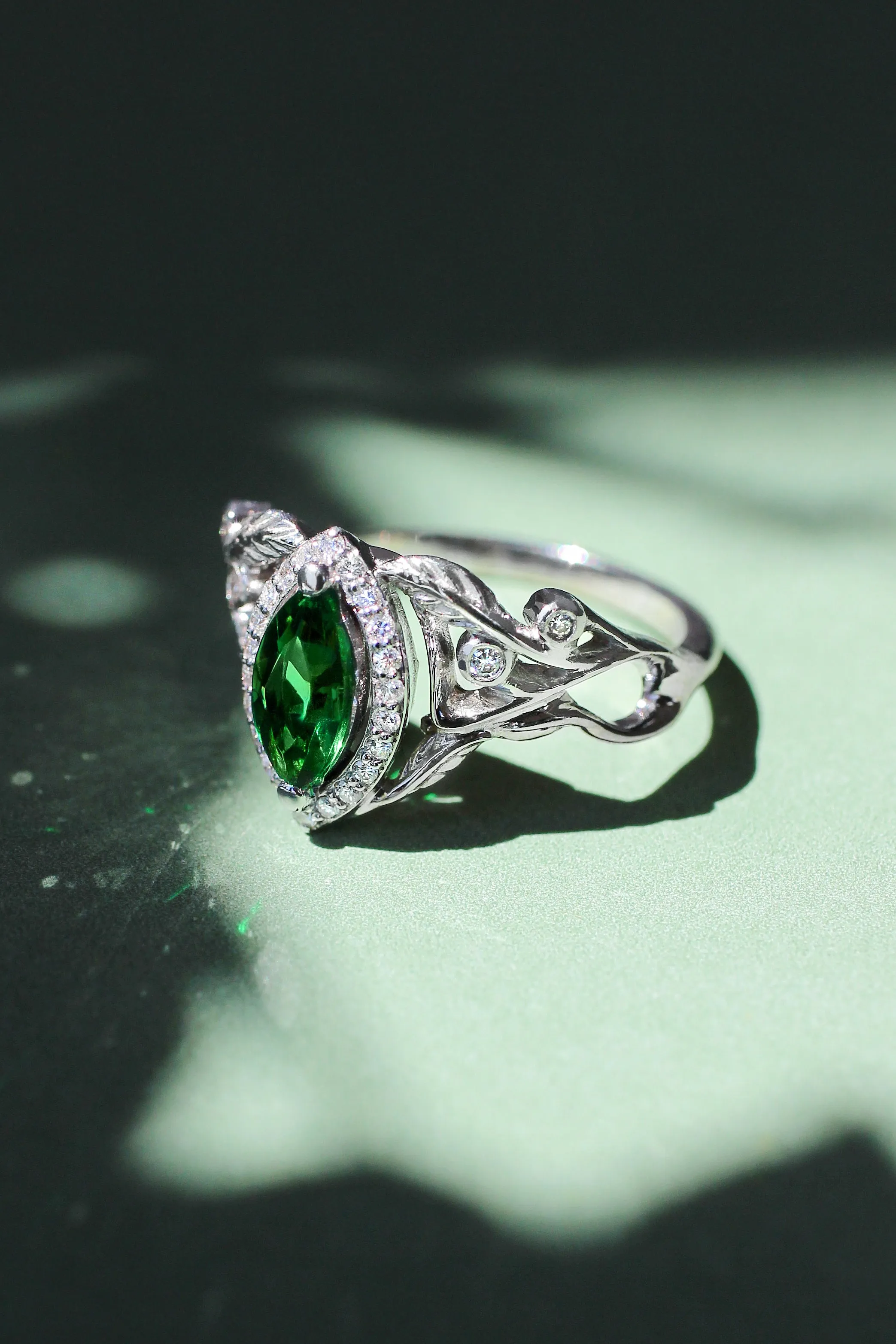 Marquise engagement ring with lab emerald and diamond halo / Callisto