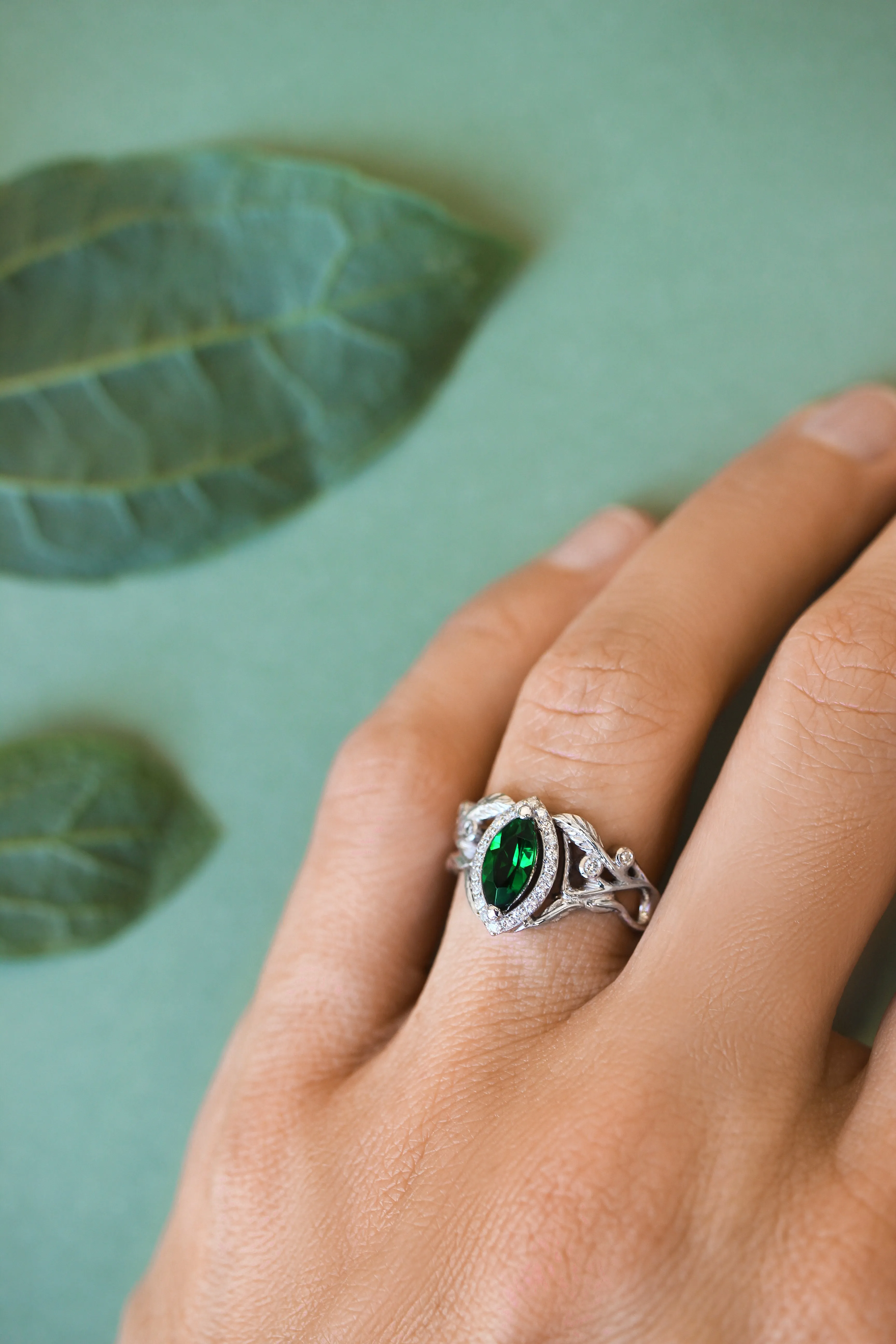 Marquise engagement ring with lab emerald and diamond halo / Callisto