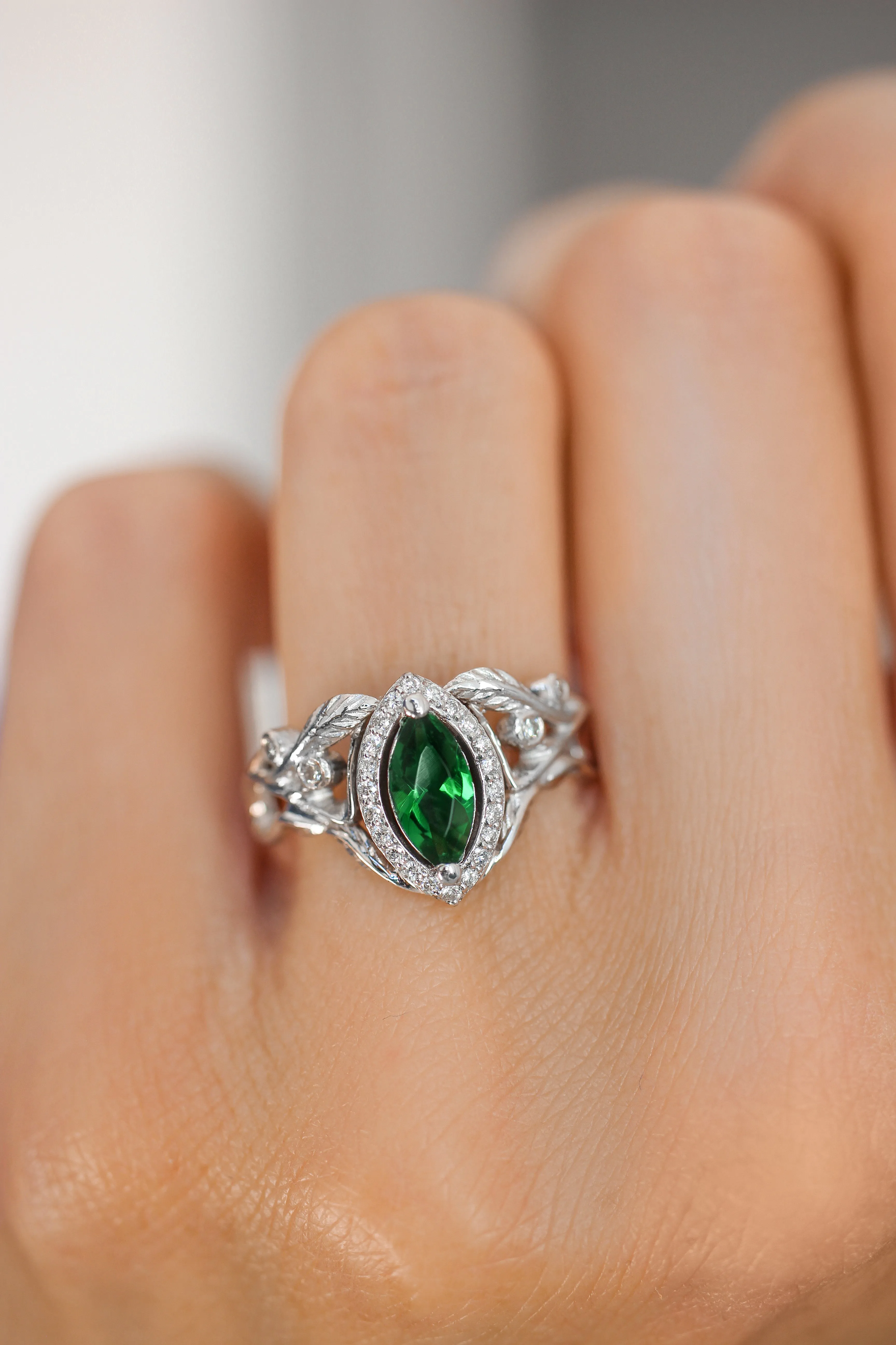 Marquise engagement ring with lab emerald and diamond halo / Callisto