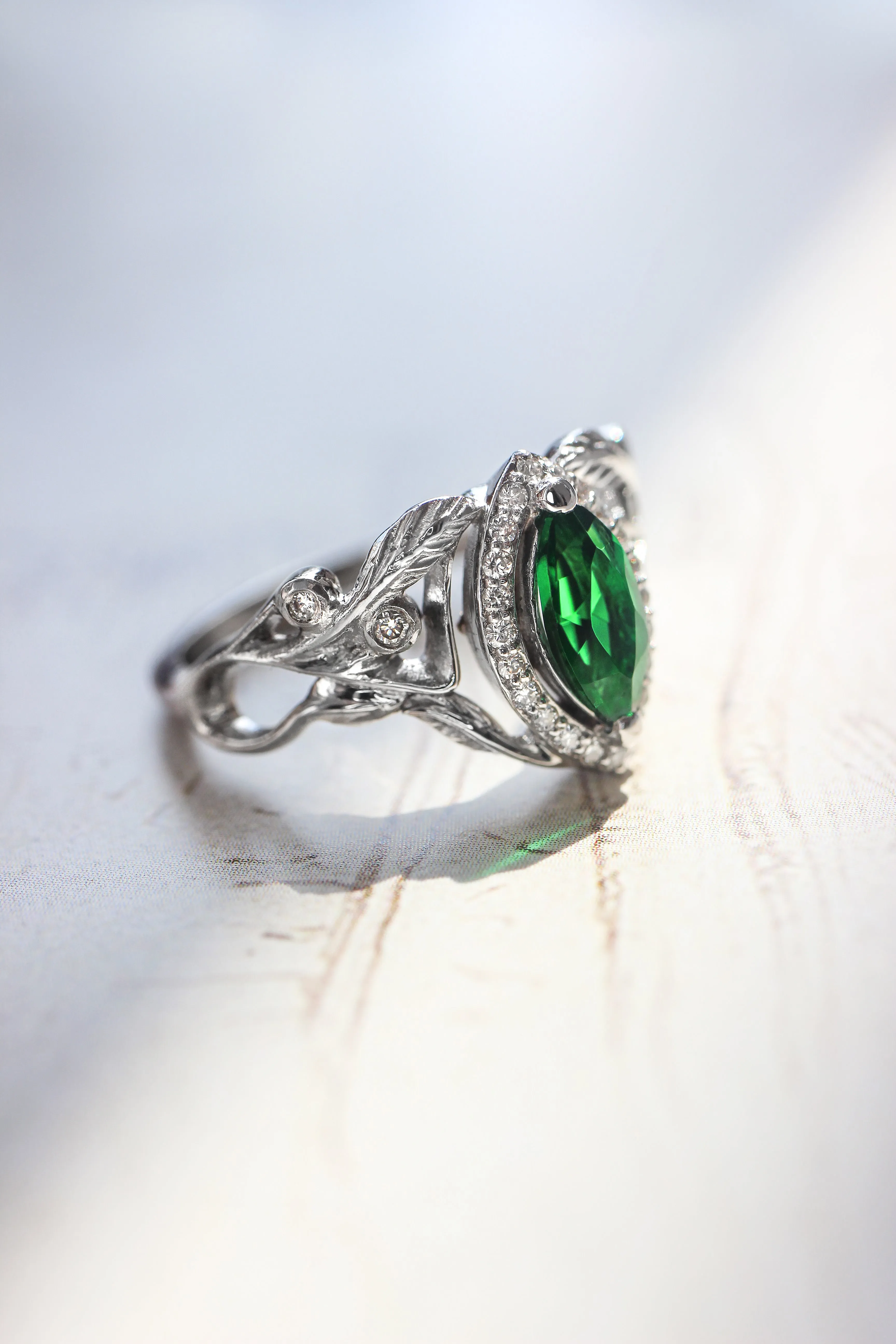 Marquise engagement ring with lab emerald and diamond halo / Callisto