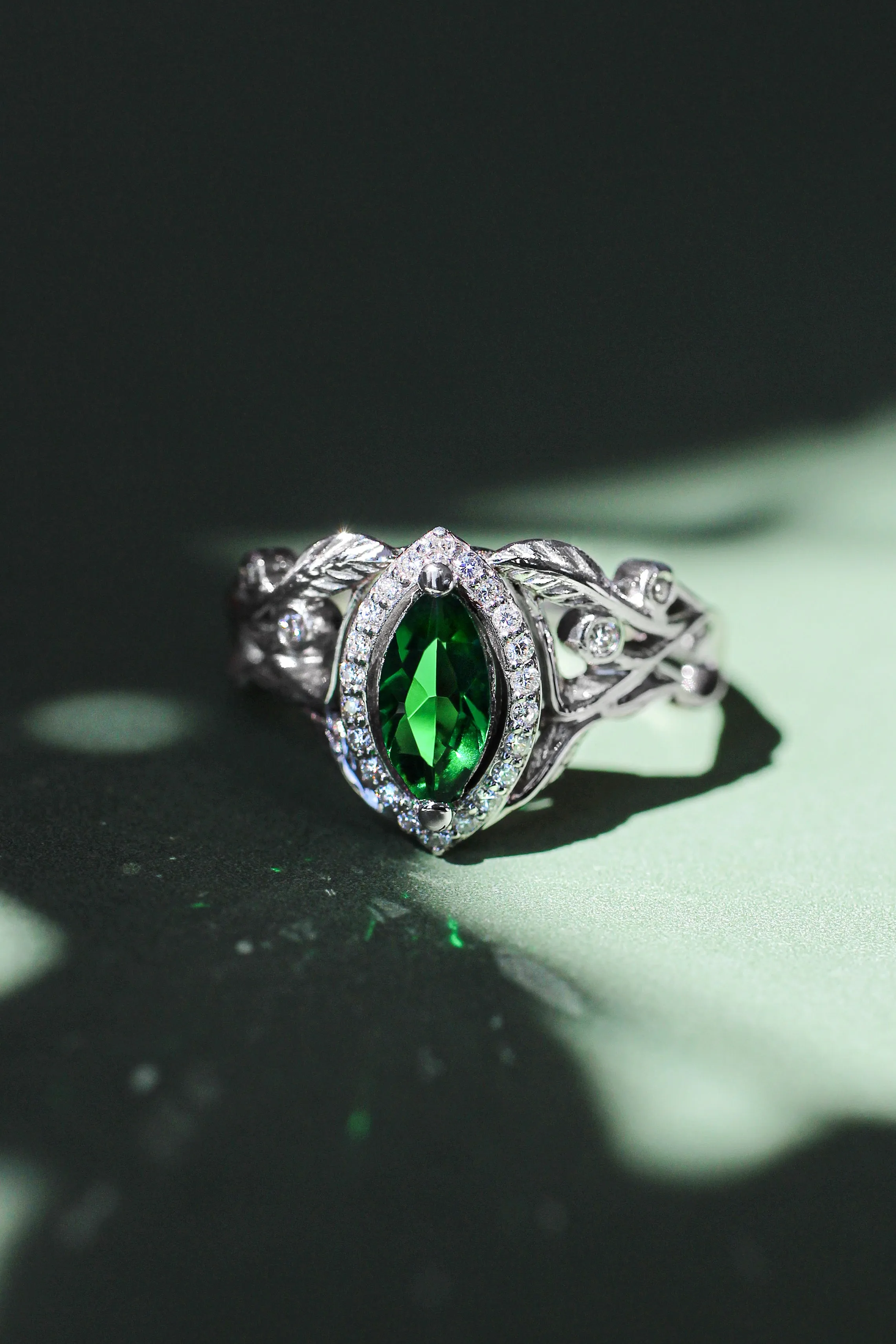 Marquise engagement ring with lab emerald and diamond halo / Callisto